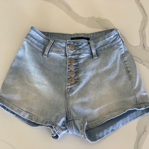 Kendall and Kylie light wash highwaisted shorts .